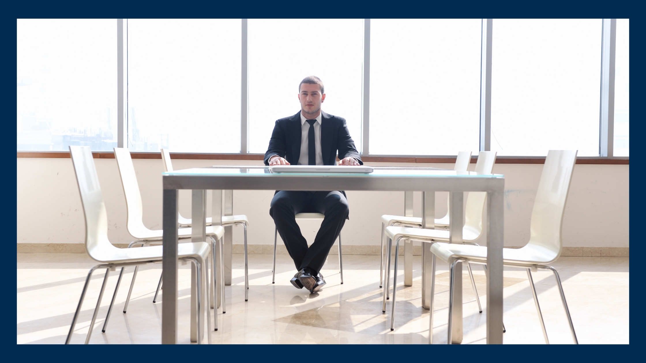 A business man sitting in a room
